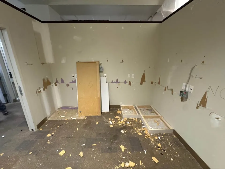 Empty office room after millwork and fixtures have been removed